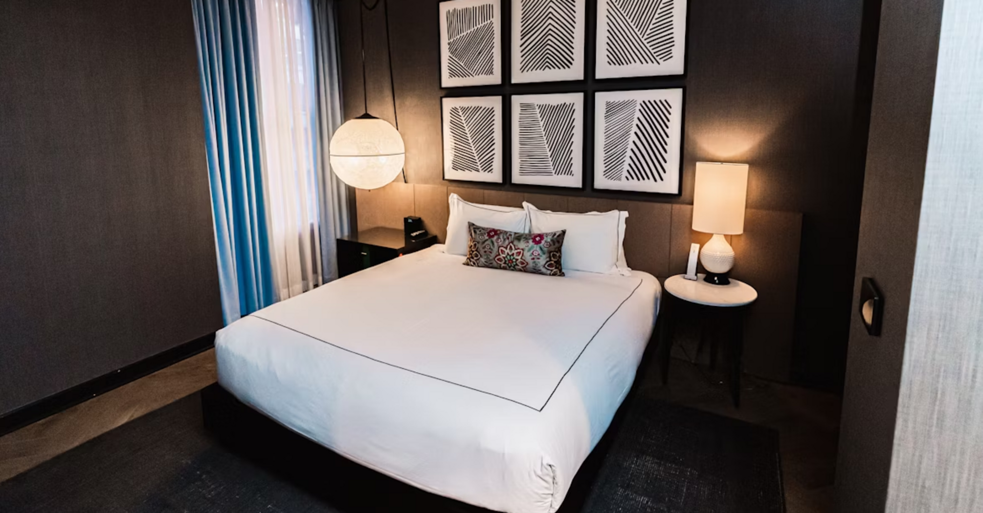 Modern hotel room with minimalist decor and soft lighting