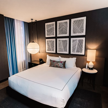 Modern hotel room with minimalist decor and soft lighting