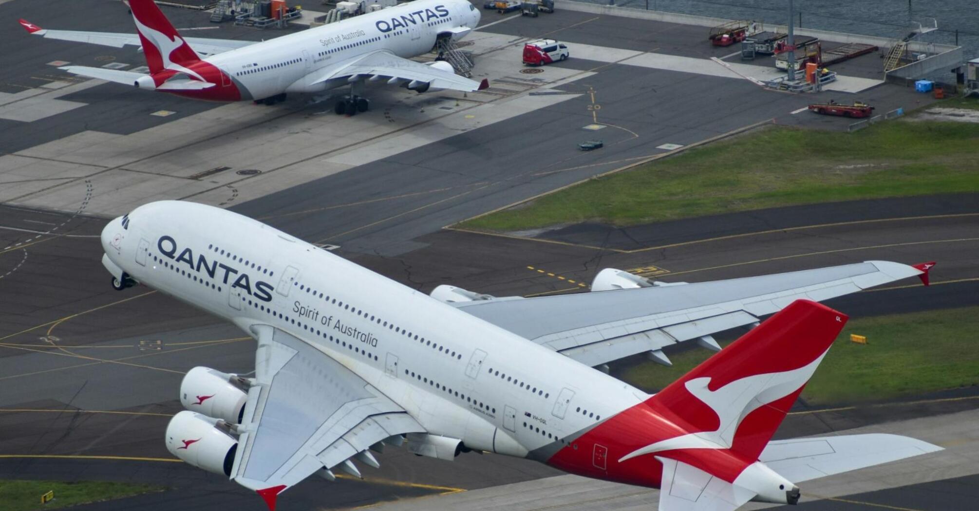 Qantas aircraft on the runway and in flight