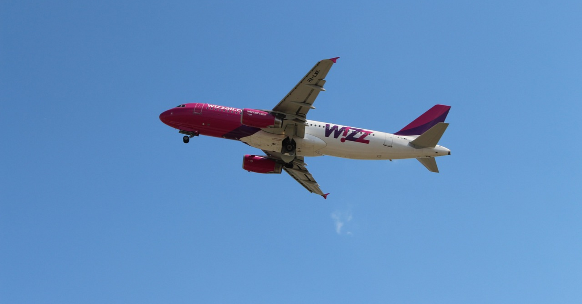 Wizz Air aircraft in flight against clear sky