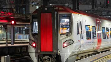 Transport for Wales train at a station platform at night
