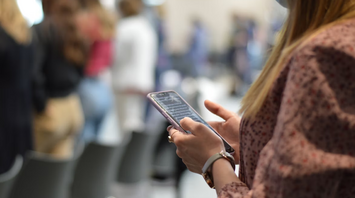 Passenger checking flight details on phone