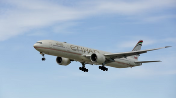Etihad Airways aircraft approaching landing under clear sky