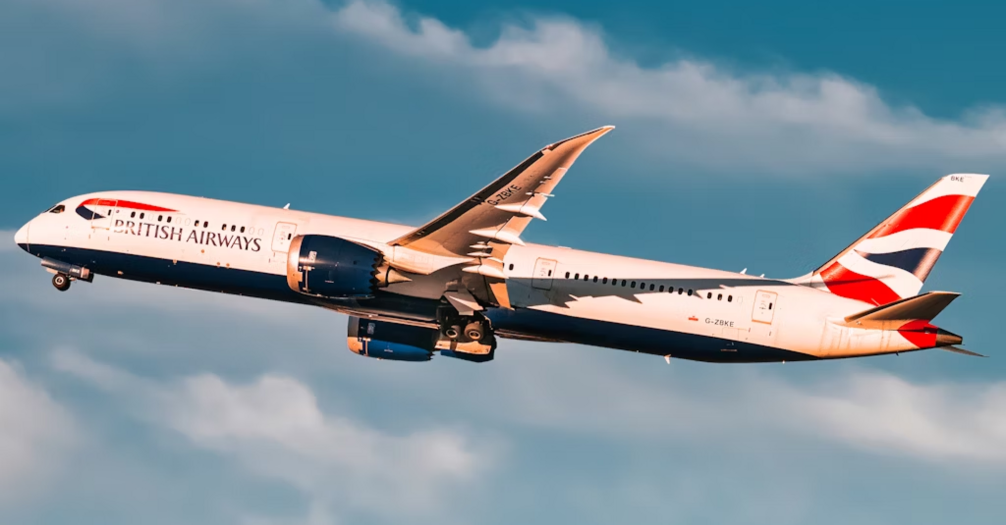 British Airways airplane in flight against blue sky