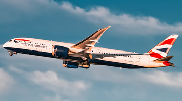 British Airways airplane in flight against blue sky