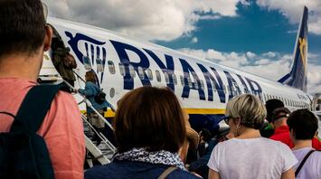 Passengers boarding a Ryanair plane at the airport