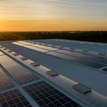 Solar panels on airport rooftops at sunset
