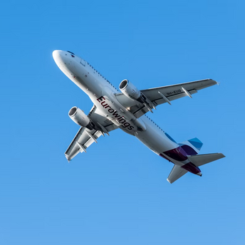 Eurowings airplane in flight against clear sky
