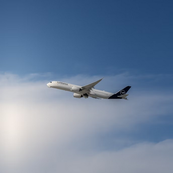 Lufthansa aircraft in flight against a blue sky