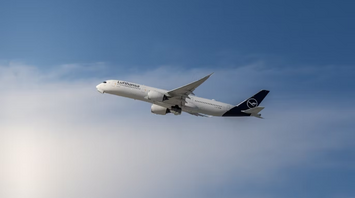 Lufthansa aircraft in flight against a blue sky