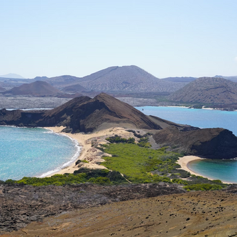 Aerial view of a volcanic coastline and beaches in the Galápagos Islands