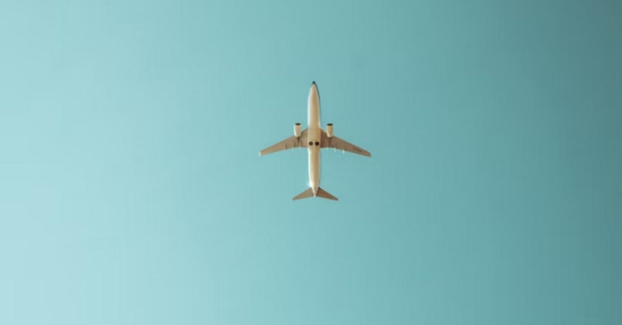 Airplane flying in a clear blue sky