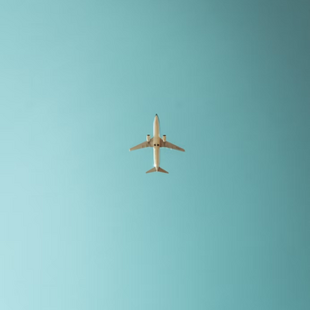 Airplane flying in a clear blue sky
