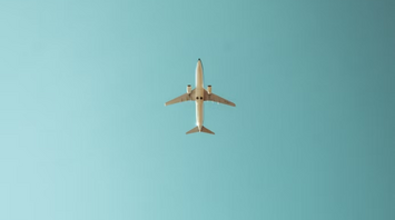 Airplane flying in a clear blue sky