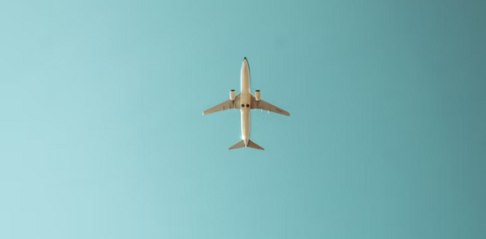 Airplane flying in a clear blue sky