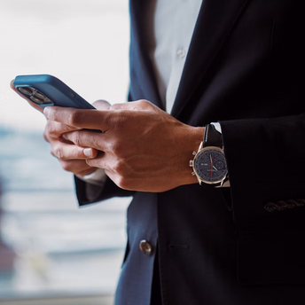 Businessperson using smartphone to access travel information