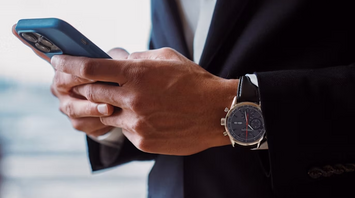 Businessperson using smartphone to access travel information