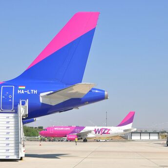 Close-up of Wizz Air aircraft tails on airport apron