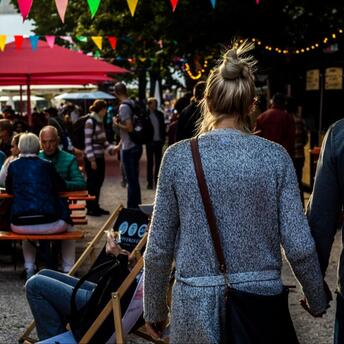 People enjoying food festival outdoors