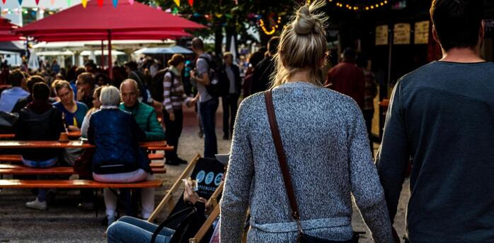 People enjoying food festival outdoors