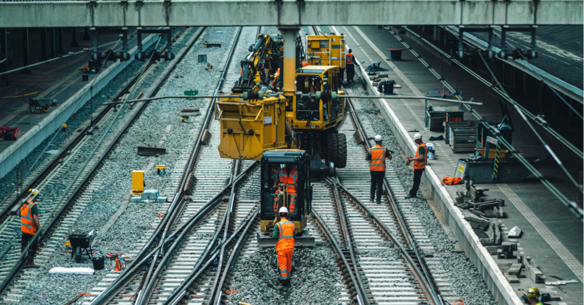 Workers repairing railway tracks during maintenance