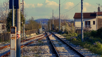 Railway signal light along rural tracks