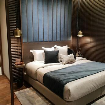 Modern hotel room with cozy design