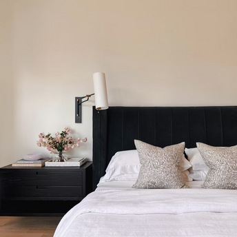 Modern hotel bedroom with black headboard