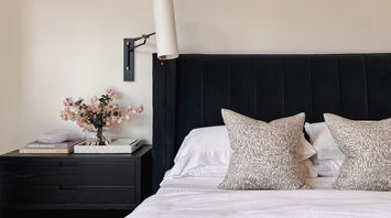 Modern hotel bedroom with black headboard