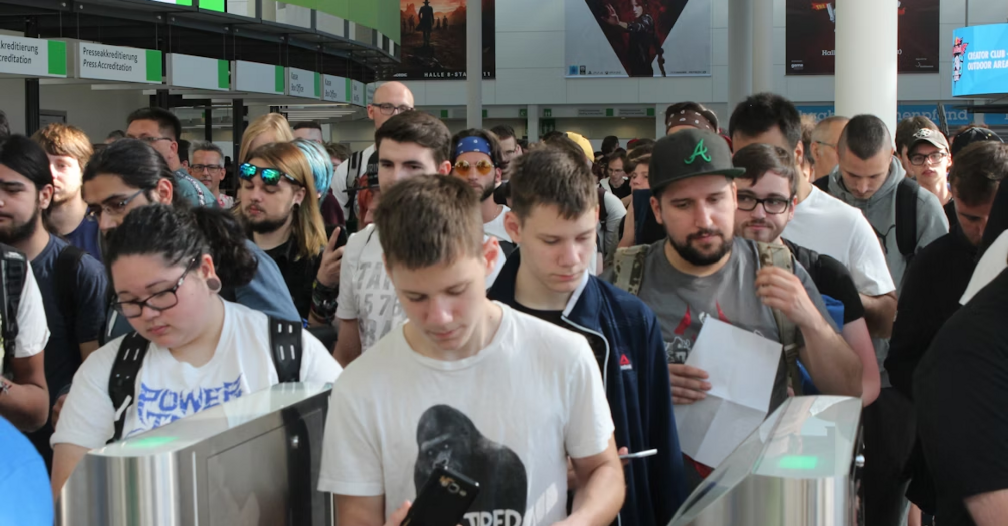 Passengers wait in long queues at airport check-in