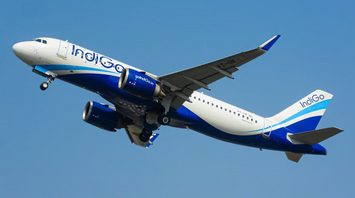 IndiGo airplane in flight against clear sky