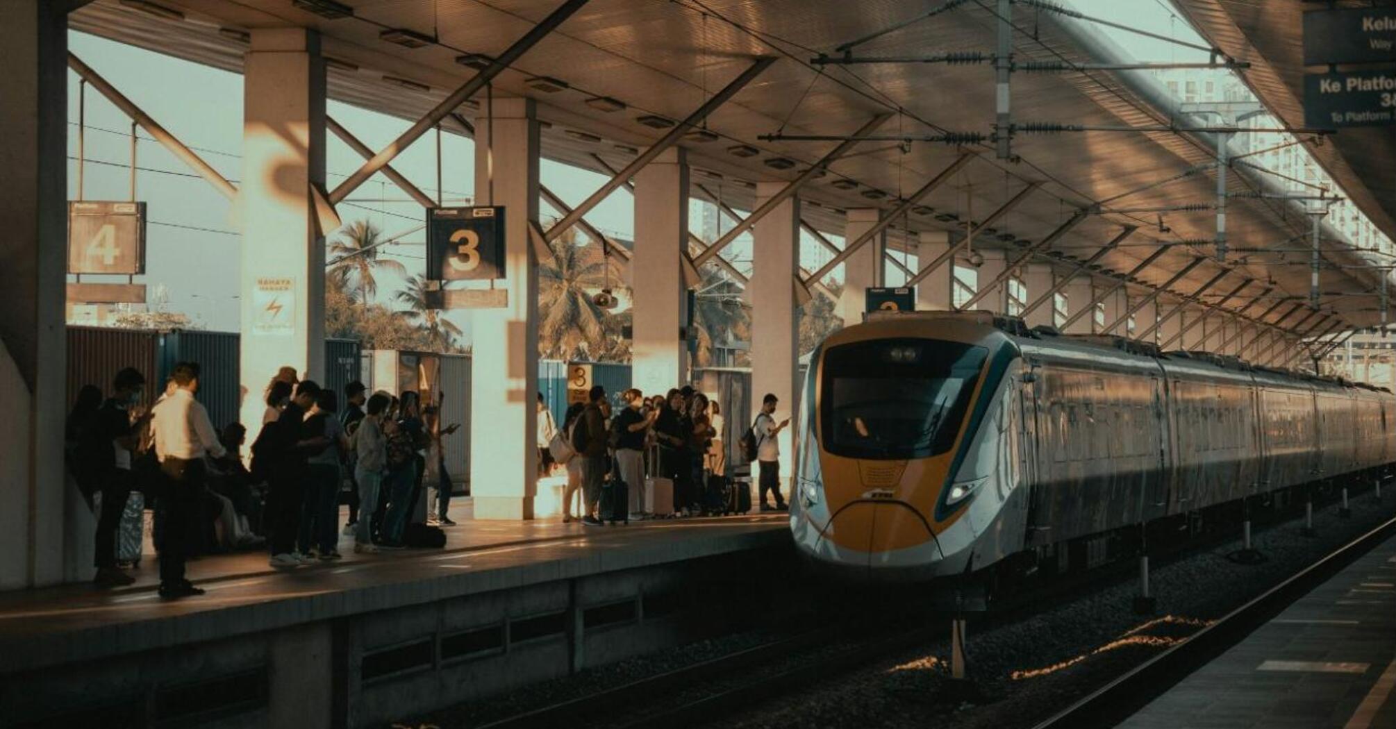 High-speed train at crowded station platform