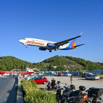 Jet2holidays plane landing over coastal road