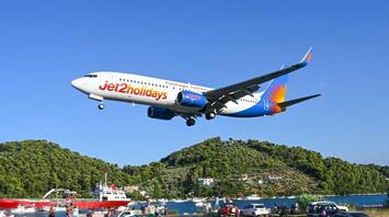 Jet2holidays plane landing over coastal road