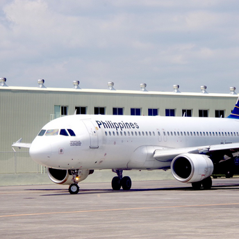 Philippine Airlines aircraft taxiing on the runway