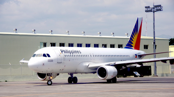 Philippine Airlines aircraft taxiing on the runway