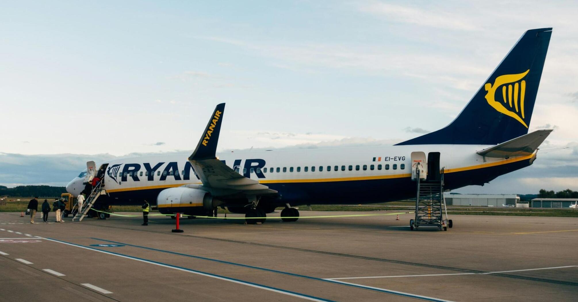Ryanair plane boarding passengers on the runway