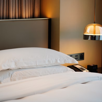 Modern hotel bedroom with bedside lighting