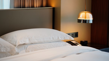 Modern hotel bedroom with bedside lighting