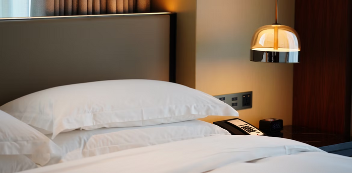 Modern hotel bedroom with bedside lighting