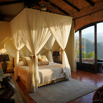 Luxury bedroom with canopy bed and mountain view
