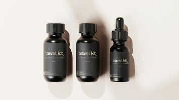 Travel-sized liquid bottles in black packaging