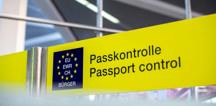 Yellow passport control sign at Schengen border