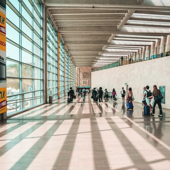 Passengers walking through Ben Gurion Airport terminal