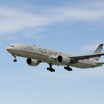 Etihad Airways aircraft in flight against blue sky