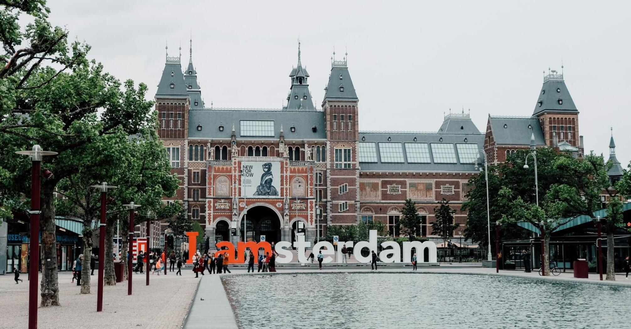Rijksmuseum with I amsterdam sign and reflecting pool