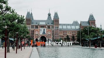 Rijksmuseum with I amsterdam sign and reflecting pool