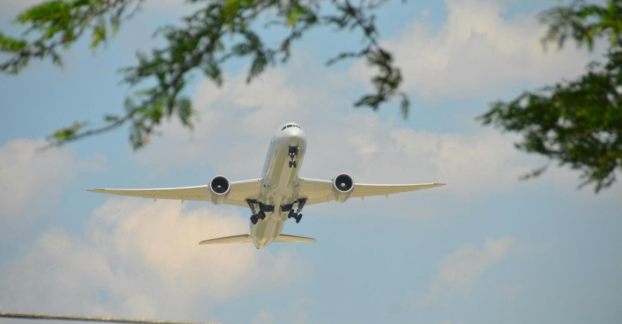 Passenger plane flying against blue sky
