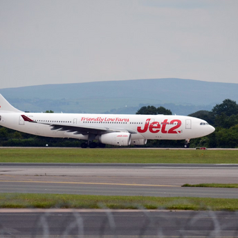 Jet2 aircraft taxiing on runway at airport
