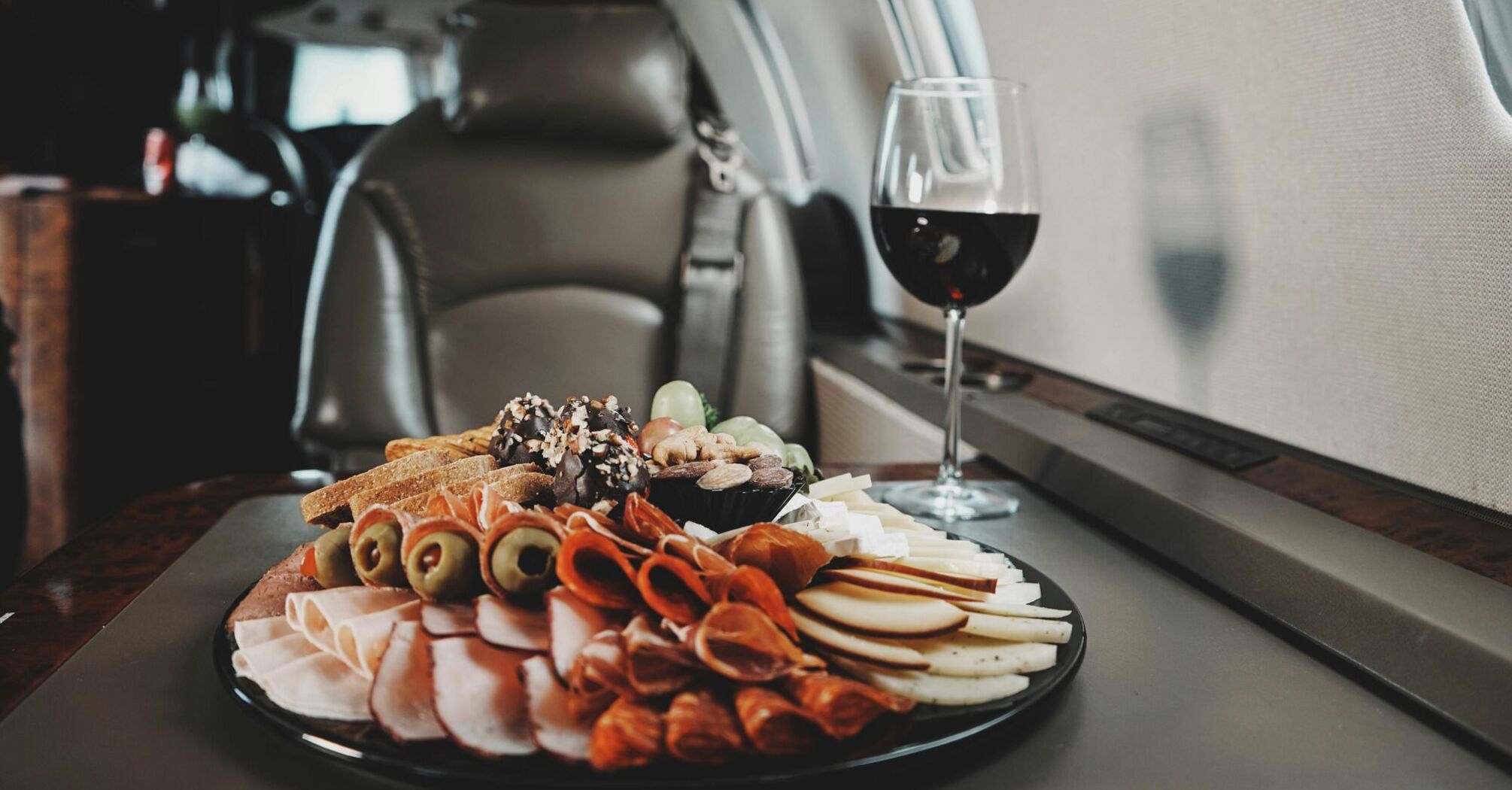 In-flight meal with charcuterie and red wine